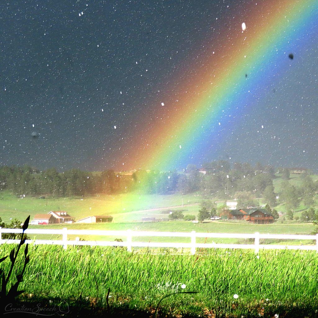 Hail storm with rainbow displays the power of God as praise to the LORD