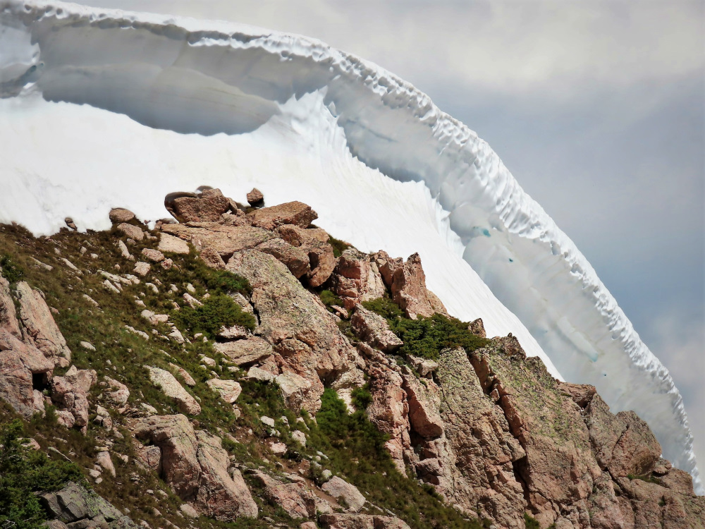 Amazing snow cornice in July on a ridge leading to Parry Peak