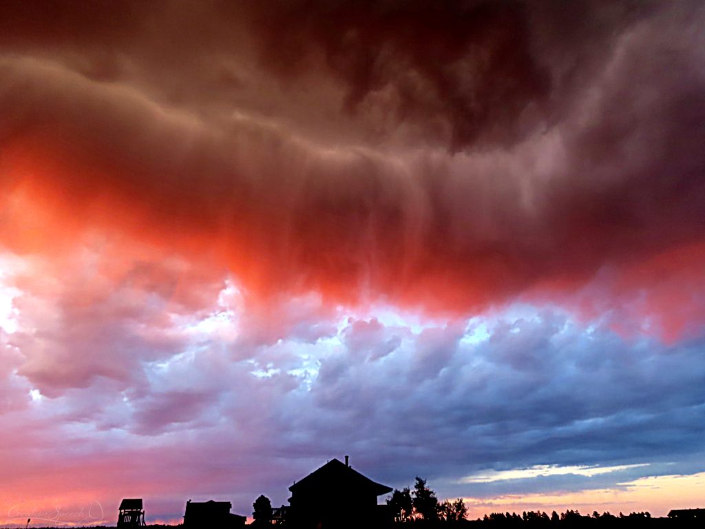 Storm at sunset proclaims the power of God with a spectacular roll cloud, praising the LORD