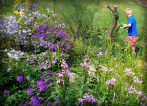 Boy helping to manage gardens for God's glory