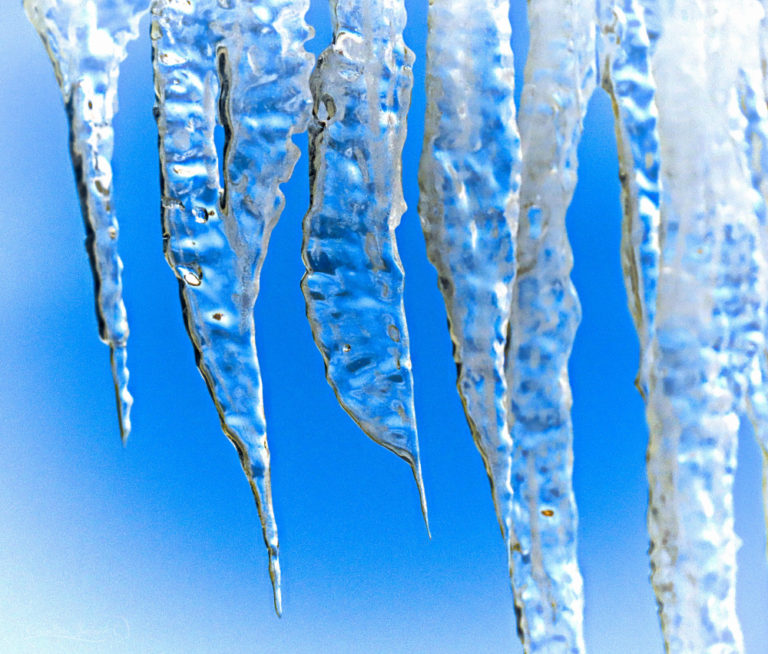 Family of icicles are beautiful as the light of God light shines through them